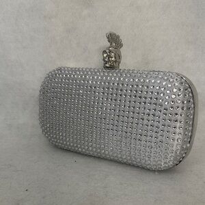 Glamorous Silver Studded Clutch with Skull Accent